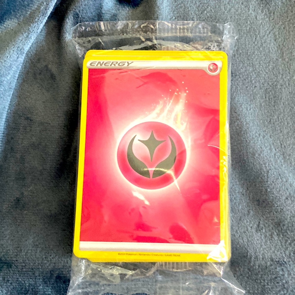 A pack of Pokémon energy cards never been opened.